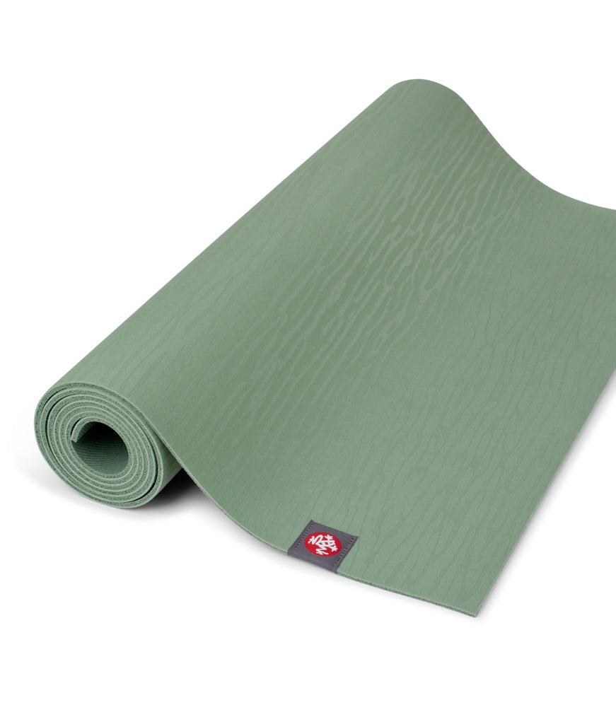 Manduka eKOLite 4mm Yoga Mat - Leaf Green - part rolled | Manduka NZ