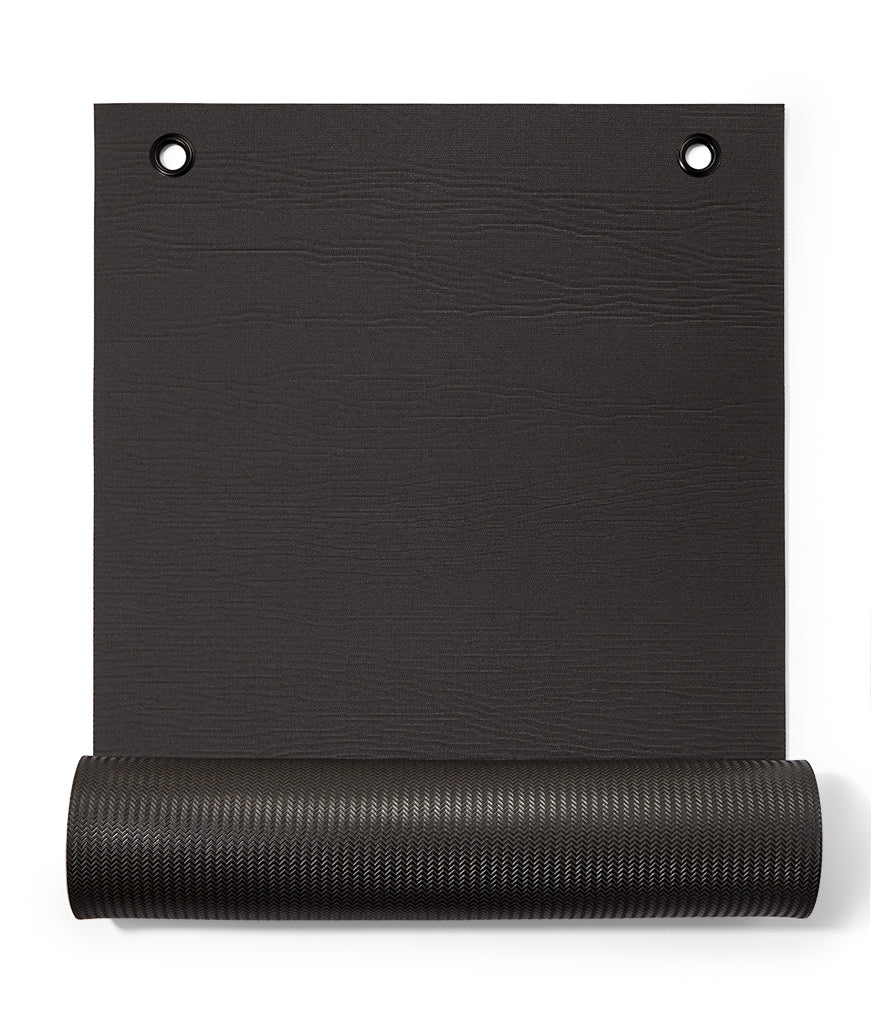 Manduka ENDURA Fitness Mat 10mm - part rolled, vertical, gromets showing | Manduka NZ
