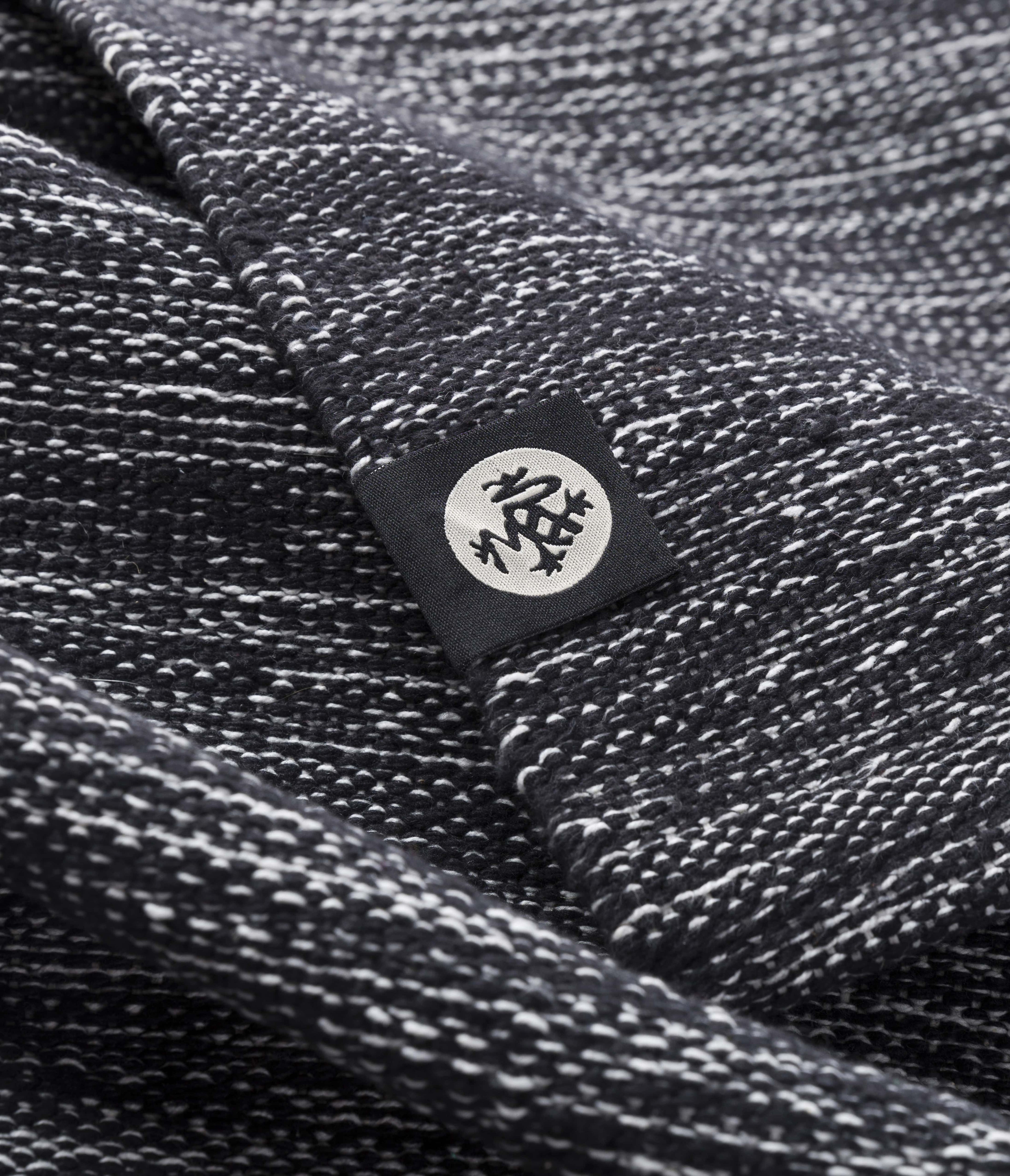 Manduka Shala Yoga Rug - Black Heather - close-up incl. logo | Manduka NZ