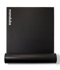 Manduka P/ROX Hybrid Fitness Mat 6mm - part rolled, vertical, Manduka logo showing | Manduka NZ