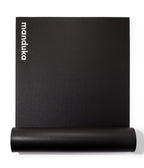 Manduka P/ROX Hybrid Fitness Mat 6mm - part rolled, vertical, Manduka logo showing | Manduka NZ