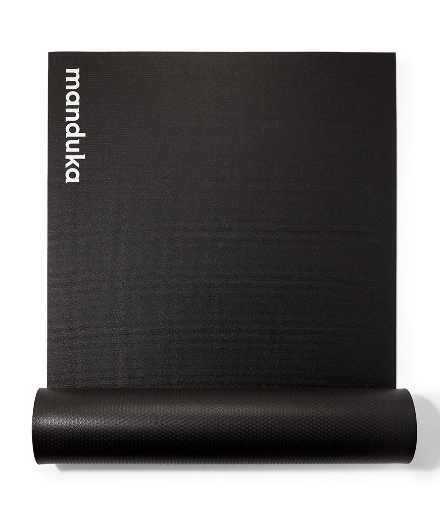 Manduka P/ROX Hybrid Fitness Mat 6mm - part rolled, vertical, Manduka logo showing | Manduka NZ