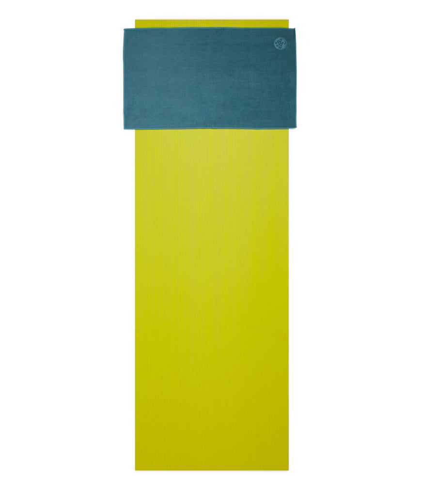 Manduka eQua Hand Towel - Sage - placed on a yoga mat | Manduka NZ