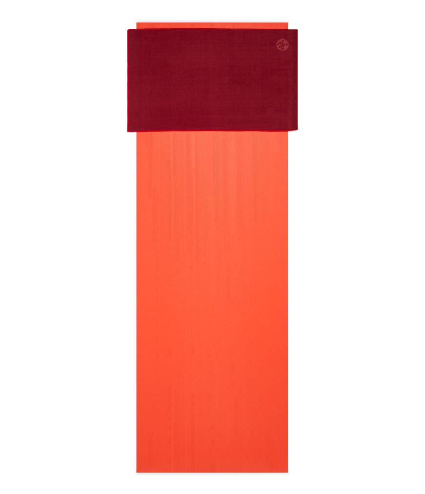 Manduka eQua Hand Towel - Verve - placed on a yoga mat | Manduka NZ