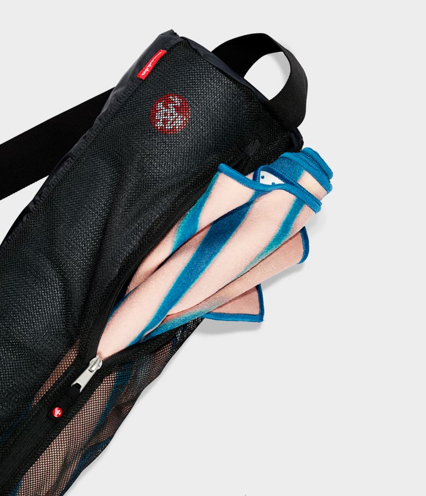 Manduka Breathe Easy Yoga Mat Bag - Black - Vertical - top section with yoga mat & yogietoes mat towel inside | Manduka NZ