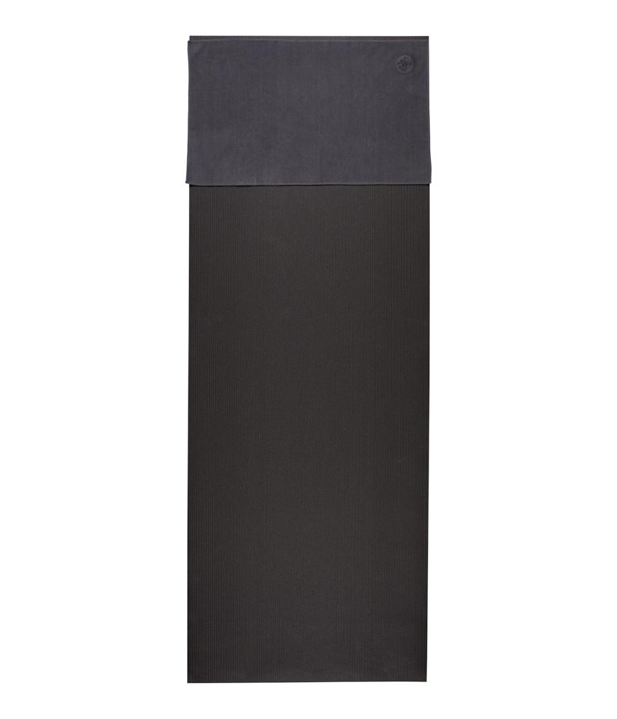 Manduka eQua Hand Towel - Thunder - placed on a yoga mat | Manduka NZ