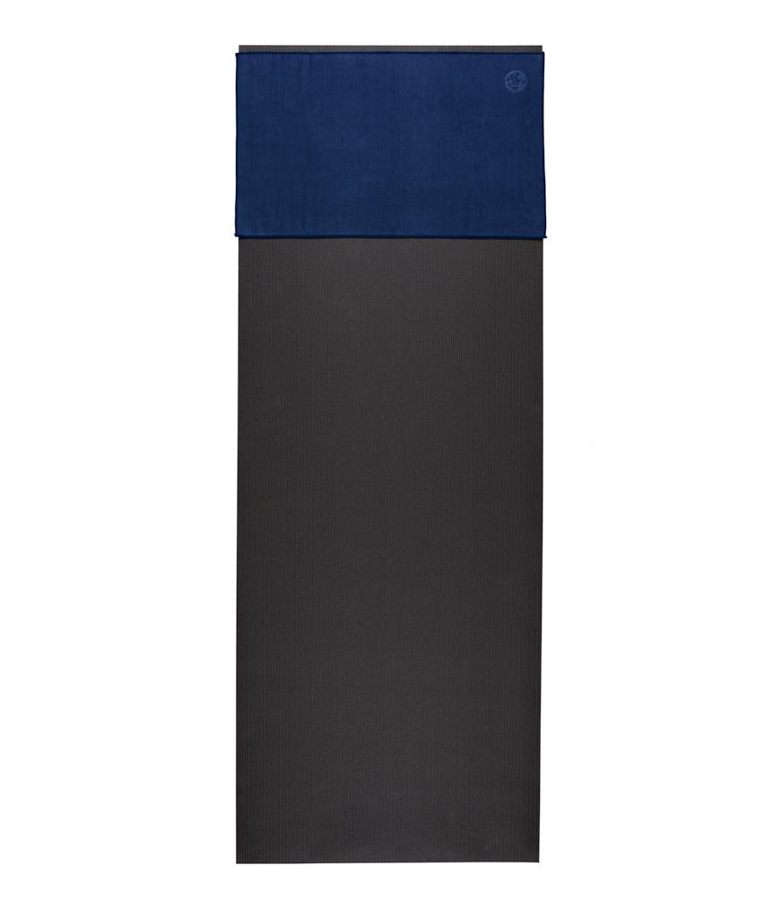 Manduka eQua Hand Towel - Midnight - placed on a yoga mat | Manduka NZ
