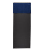 Manduka eQua Hand Towel - Midnight - placed on a yoga mat | Manduka NZ
