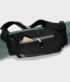 Manduka Go Play 3.0 Mat Carrier - Black - around mat with mobile phone in accesory pocket | Manduka NZ