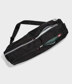 Manduka Go Steady 3.0 Mat Bag - Black - filled with yoga mat, zip half undone | Manduka NZ