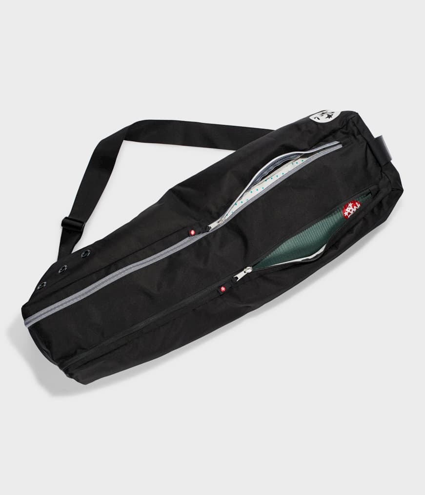 Manduka Go Steady 3.0 Mat Bag - Black - filled with yoga mat, zip half undone | Manduka NZ