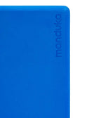 Manduka Recycled Foam Block - Be Bold Blue - corner view, with logo | Manduka NZ