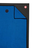 Manduka Yogitoes Mat Towel - Be Bold Blue - lying flat, corner folded over | Manduka NZ