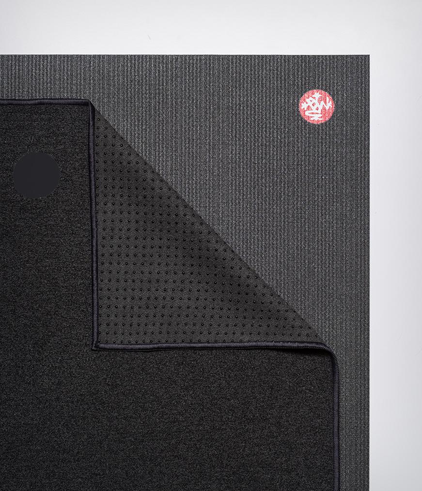 Manduka Yogitoes Mat Towel - Onyx - lying flat, corner folded over | Manduka NZ