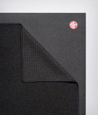 Manduka Yogitoes Mat Towel - Onyx - lying flat, corner folded over | Manduka NZ