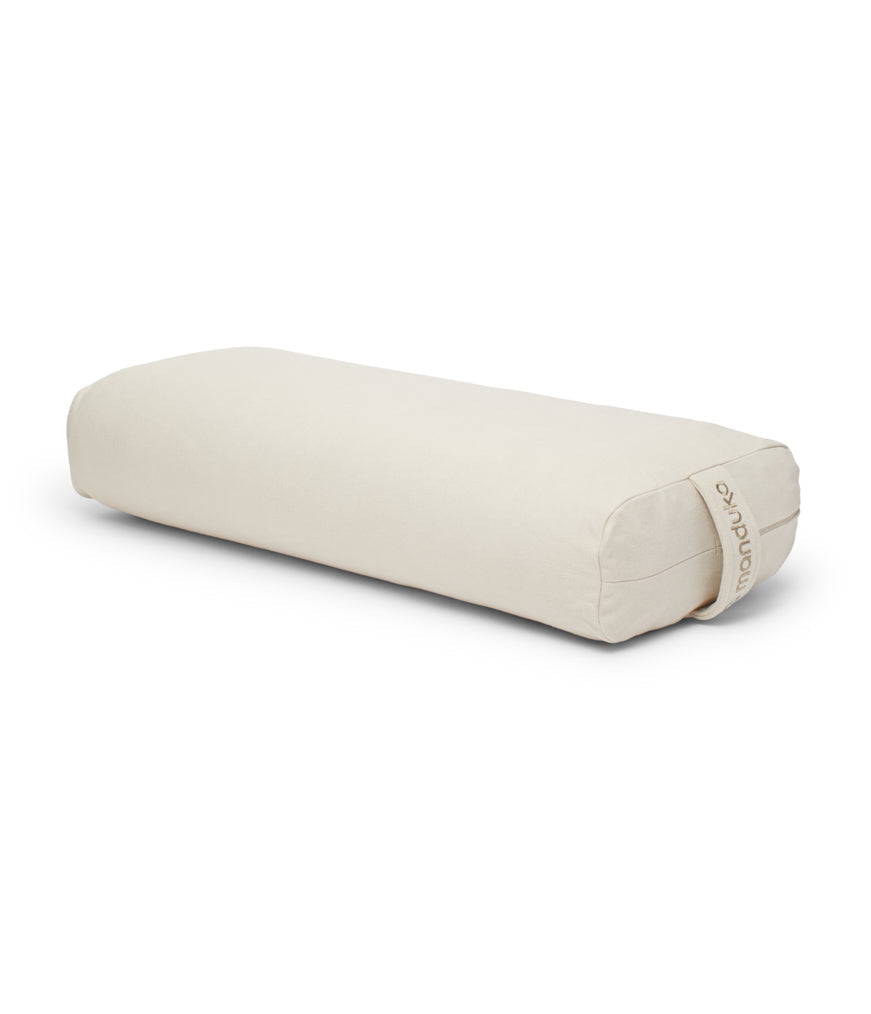 Manduka Enlight Rectangular Bolster - Sand - 45 degree angle view | Manduka NZ
