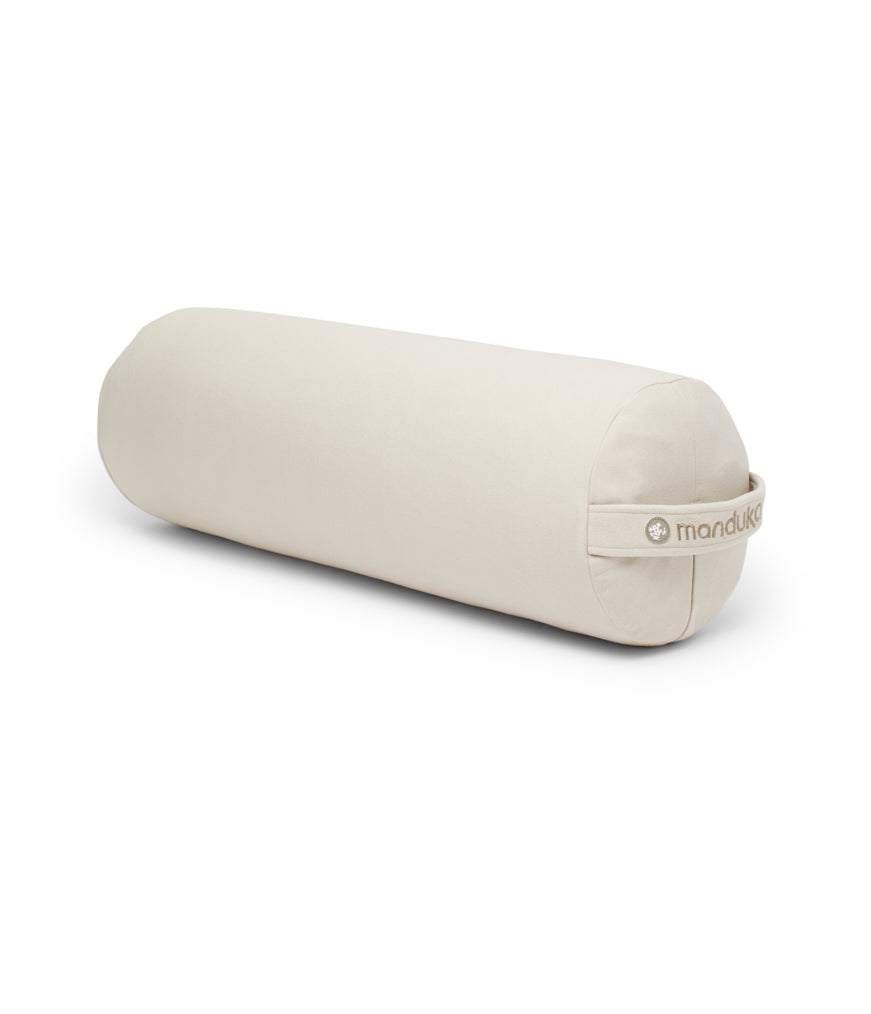 Manduka Enlight Round Bolster - Sand - angle view | Manduka NZ
