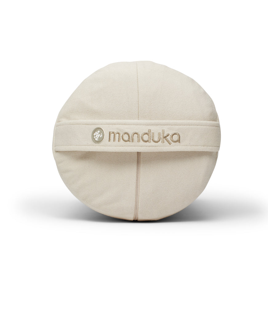 Manduka Enlight Round Bolster - Sand - side on + handle | Manduka NZ