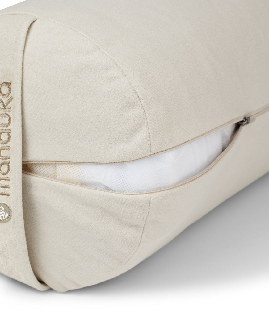 Manduka Enlight Round Bolster - Sand - exposed filling | Manduka NZ