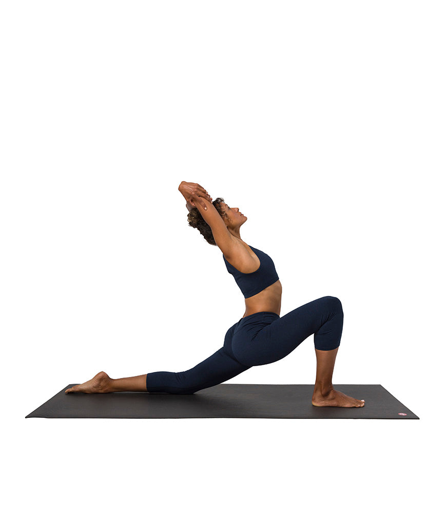 Dhara Capri Legging - Midnight Heather - model in asana on PRO Yoga Mat - Gallery Image 5 | Manduka | Manduka NZ
