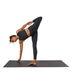 Dhara Legging - Phantom - model in asana on PRO Yoga Mat - Gallery Image 7 | Manduka | Manduka NZ