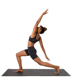 Dhara Short - Phantom - model in asana on PRO Yoga Mat - Gallery Image 9 | Manduka | Manduka NZ