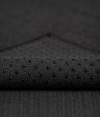 Manduka Yogitoes Mat Towel - Onyx - corner folded over showing underside | Manduka NZ