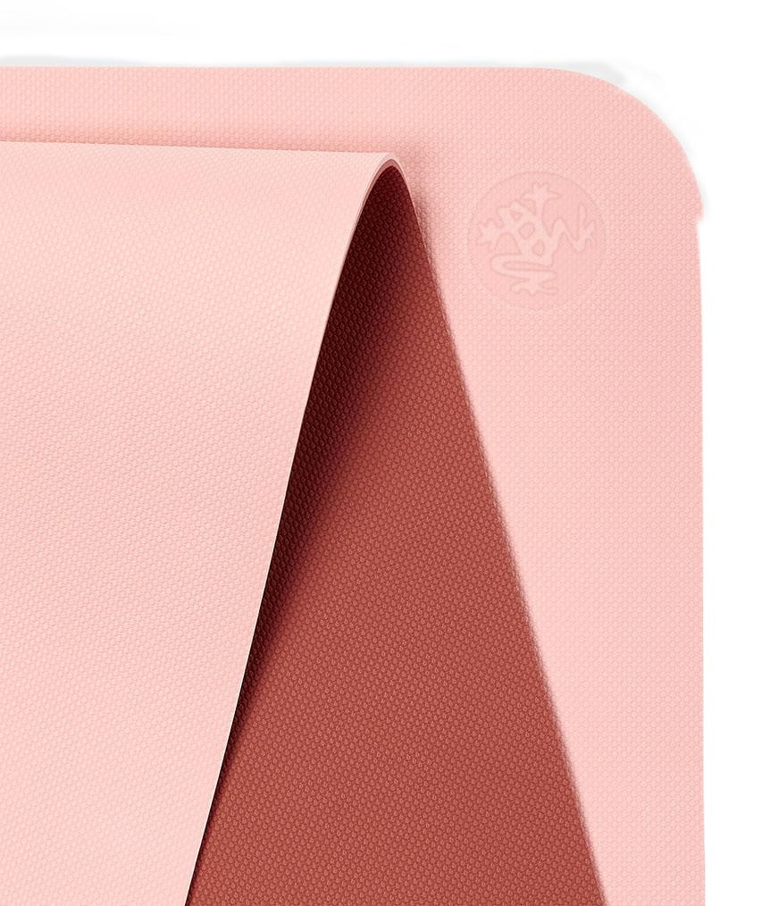 Manduka Begin Mat 5mm Yoga Mat - Coral - top corner loosely rolled showing both sides | Manduka NZ