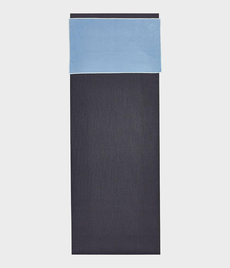 Manduka eQua Hand Towel - Clear Blue - placed on a yoga mat | Manduka NZ