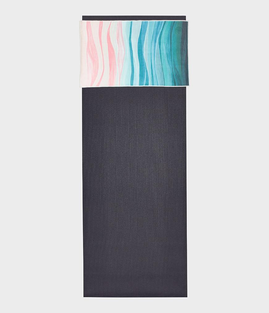 Manduka eQua Hand Towel - Ebb and Flow - placed on a yoga mat | Manduka NZ