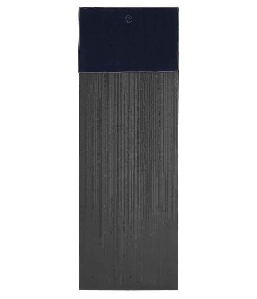 Manduka Yogitoes Hand Towel - Midnight - lying flat on top of a yoga mat | Manduka NZ