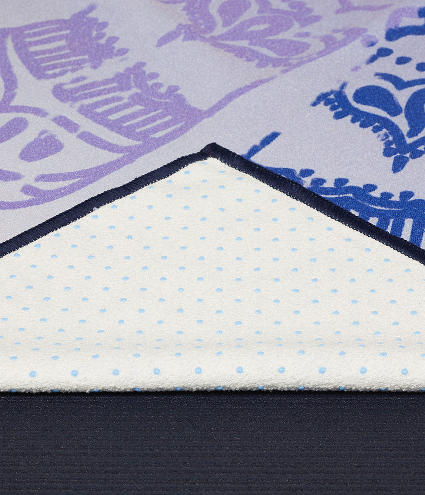 Manduka Yogitoes Mat Towel - Chakra Print (Blue) - corner folded over showing underside | Manduka NZ