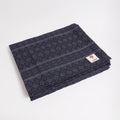 Manduka Cotton Blanket - Thunder - folded with logo | Manduka NZ
