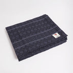 Manduka Cotton Blanket - Thunder - folded with logo | Manduka NZ