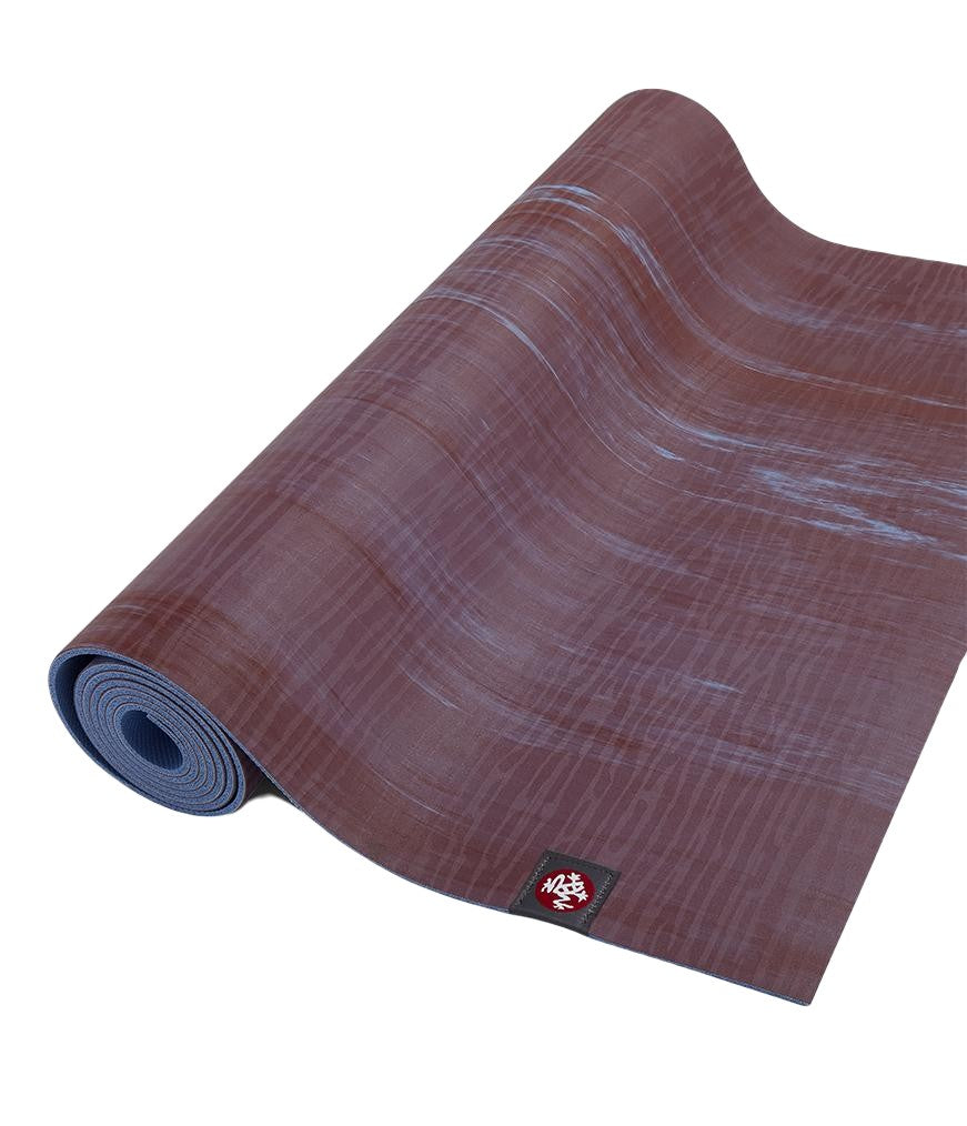 Manduka eKOLite 4mm Yoga Mat - Root Marbled - part rolled | Manduka NZ