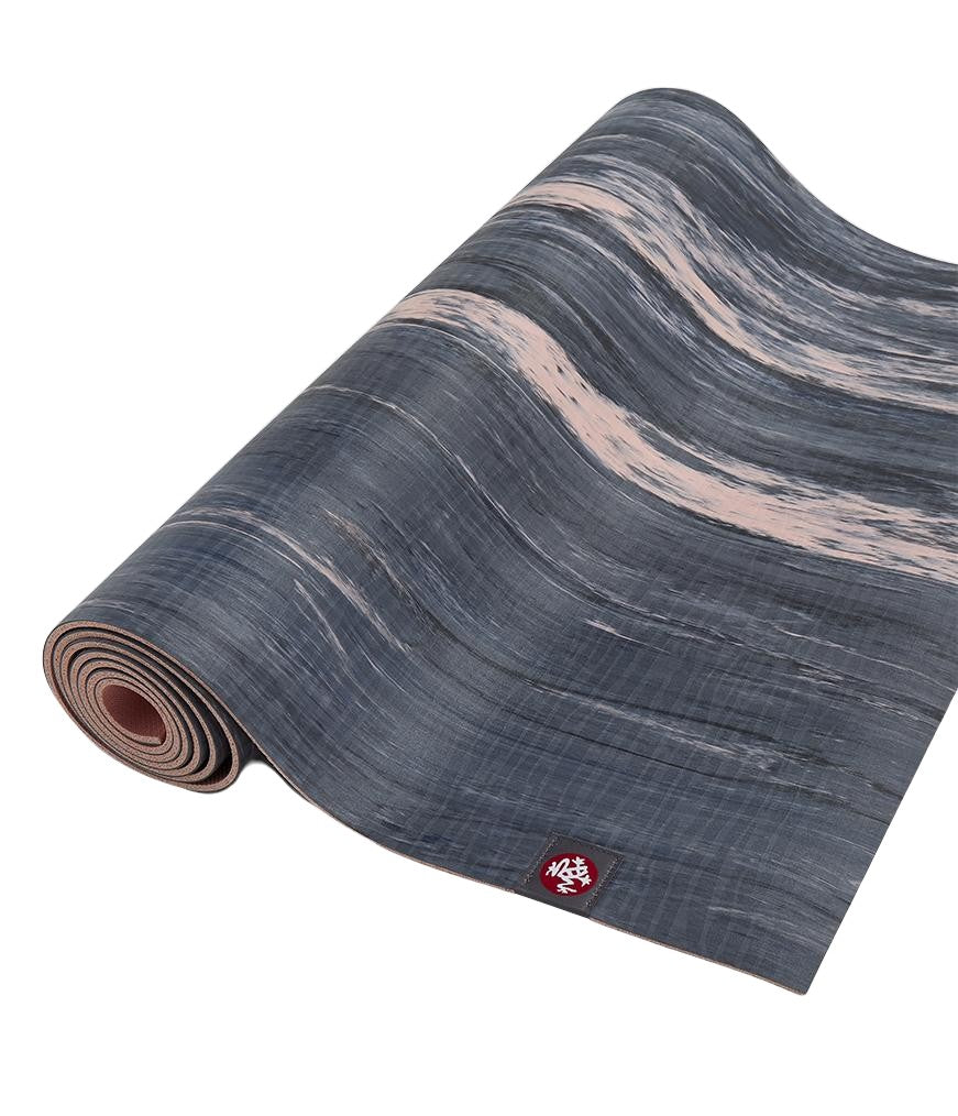 Manduka eKOLite 4mm Yoga Mat - Coral Marbled - part rolled | Manduka NZ