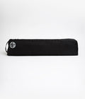 Manduka Go Light 3.0 Mat Carrier - Black - filled, on side, horizontal | Manduka NZ 