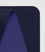 Manduka Begin Mat 5mm Yoga Mat - Navy - top corner loosely rolled showing both sides | Manduka NZ