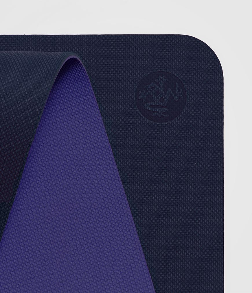 Manduka Begin Mat 5mm Yoga Mat - Navy - top corner loosely rolled showing both sides | Manduka NZ