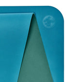 Manduka Begin Mat 5mm Yoga Mat - Bondi Blue - top corner loosely rolled showing both sides | Manduka NZ