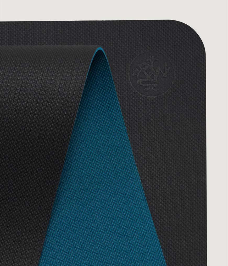 Manduka Begin Mat 5mm Yoga Mat - Steel Grey - top corner loosely rolled showing both sides | Manduka NZ